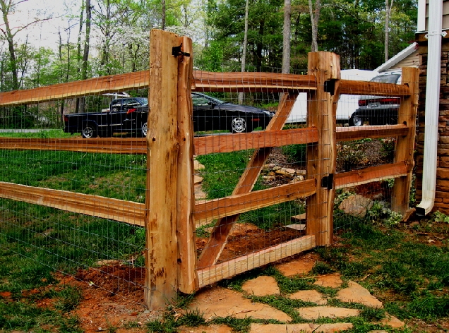 Cedar split rail fencing with wire mesh